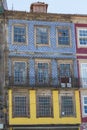 Typical Colorful Portuguese Architecture: Tile Azulejos Facade with Antique Windows And Balcony - Portugal Royalty Free Stock Photo