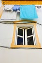 Typical colorful Portuguese facade with hanging clothes