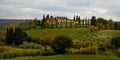 Typical country houses and cypresses in Tokana - TUSCANY, ITALY - NOVEMBER 25, 2021