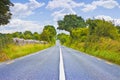 Typical country road in the Irish rural areas in the summer season Ireland Royalty Free Stock Photo