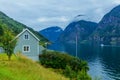 Typical countryside Norwegian landscape with green wall house. Cloudy summer morning in Norway, Europe. Royalty Free Stock Photo
