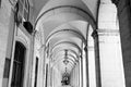 typical covered walkway, the portico of placa do comercio, lisbon,black and white Royalty Free Stock Photo