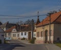 Typical czech road in village in sunny winter blue sky day