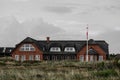 Typical danish house witch thatched roof on shores of Blavand beaches Royalty Free Stock Photo