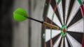 a typical darts game with dart in the bullseye Royalty Free Stock Photo