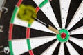 a typical darts game with dart in the bullseye Royalty Free Stock Photo