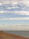 Exmouth, devon: low tide, beach and walkers. Cloudscape horizon