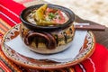 Typical dish of Bulgaria - Gyuveche. Meal baked in a clay po