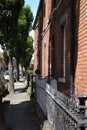 Typical Dublin street, brick building and metal fence.