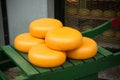 Typical Dutch Cheese wheels on a green cart Royalty Free Stock Photo