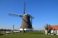 Typical dutch landscape with an old windmill in the polder near Roelofarendsveen, south holland, the Netherlands Royalty Free Stock Photo