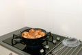 Typical Dutch oliebollen in hot oil Royalty Free Stock Photo