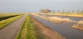 Typical dutch open landscape on a windy day stormy sky Royalty Free Stock Photo