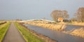 Typical dutch open landscape on a windy day stormy sky Royalty Free Stock Photo