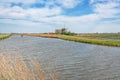 Typical Dutch polder landscape with mill Royalty Free Stock Photo