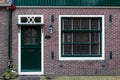 Typical dutch rural front door and window. Vintage European village house facade. Beautiful retro entrance doors Netherlands