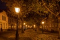 A typical Dutch street The Hooglandse Kerkgracht, with old buildings and beautiful, lighted lamp posts, Leiden, the Netherlands Royalty Free Stock Photo