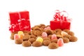 Typical dutch sweets: pepernoten (ginger nuts) and red presents Royalty Free Stock Photo