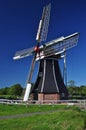 Typical Dutch windmill against a blue sky, Holland.