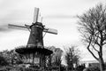 Typical Dutch windmill in Alkmaar, black and white landscape Royalty Free Stock Photo