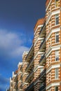 Typical english red brick house with dramatic blue sky. Royalty Free Stock Photo