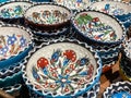Typical ethnic porcelain bowls on sales with floral and ornamentic pattern. Traditional styled souvenir from Turkey Royalty Free Stock Photo
