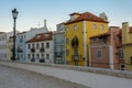 Typical exterior of old houses in a narrow street in Lisbon