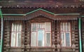 Typical Facade with carved ornaments of an old wooden house in russian stile Royalty Free Stock Photo