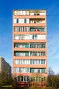 Typical facade of an old apartment building in a poor area, cheap city quarter Royalty Free Stock Photo