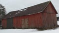 A typical Finnish building with wide and normal doors where grain and agricultural machinery are stored.