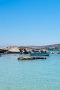 Typical fishing boat on crystal clear turquoise sea water Paros island, Greece Royalty Free Stock Photo
