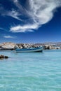 Typical fishing boat on crystal clear turquoise sea water Royalty Free Stock Photo