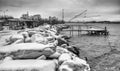 Typical fishing net and fisher house with over the sea in Marina di Pisa after a snowstorm - Tuscany, Italy