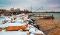 Typical fishing net and fisher house with over the sea in Marina di Pisa after a snowstorm - Tuscany, Italy