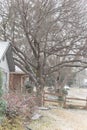 Typical font yard entrance of suburban bungalow house in heavy snow fall near Dallas, Texas, USA