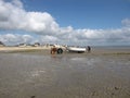 A tractor with fishing boat at the french coast in normandy in summer