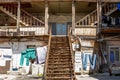 A typical georgian yard of an old traditional wooden house and clothes and linen drying on the ropes. Tbilisi Georgia