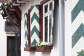 Typical german architecture - Green and white traditional window shutters Royalty Free Stock Photo