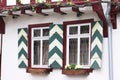 Typical german architecture - Green and white traditional window shutters Royalty Free Stock Photo