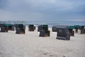 Typical german beach chairs or beach chairs baskets on the beach of Nord or Baltic sea in the evening Royalty Free Stock Photo