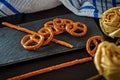 Typical German Bretzel. German food and snack. Delicious savory appetizer for lunch. Salted cracker bottom on slate bottom