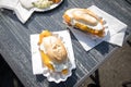 Typical German Friesland deep fried Pollack fish in beer batter as bread bun roll and as dish with French fries, mayonnaise, sauce Royalty Free Stock Photo