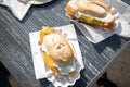 Typical German Friesland deep fried Pollack fish in beer batter as bread bun roll with sauce tartar on wooden table Royalty Free Stock Photo