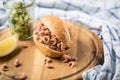 Typical German Friesland north sea crab bun with cucumber salad and lemon on wooden board and marble table