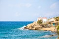 Typical Greek church white building with red dome against the blue sky on the island Mykonos, Greece Royalty Free Stock Photo