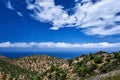 Typical Greek or Cretan landscape, hills and mountains, spring foliage, bush, olive tree, rocky road, path. Akrotiri Royalty Free Stock Photo