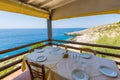 Traditional chairs with a table near the beautiful Greek sea at Zakynthos island in Greece Royalty Free Stock Photo