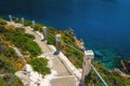 Typical Greek white stairs leading to divers bay on Greek coast Royalty Free Stock Photo