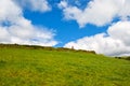 Typical green Irish country side with blue sky and man alone