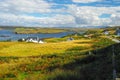 Typical green meadows and seaside of Isle of Skye, Scotland, on a sunny beautiful day of summer. Bright green and blue